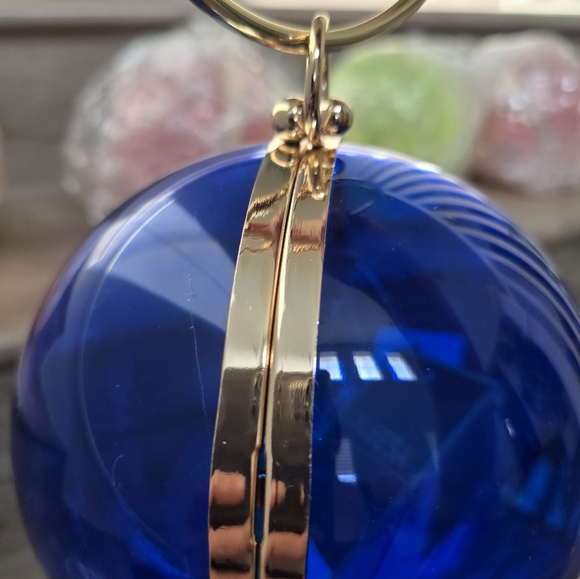 Cobalt blue wristlet round ball, gold trim and gold crossbody chain. - Picture 4 of 9